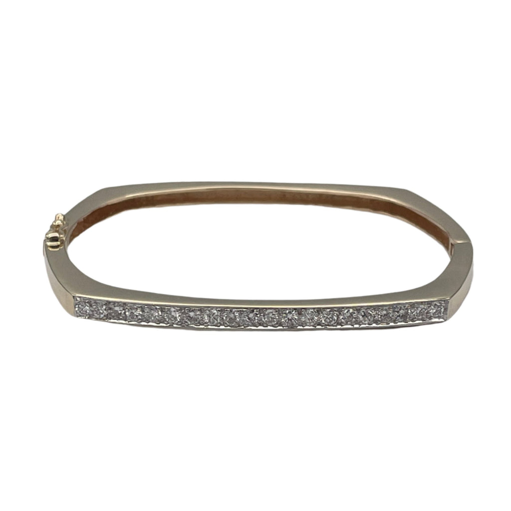 Lovely 14k hollow yellow gold and diamonds bangle bracelet. This bangle attaches with a slide clasp.