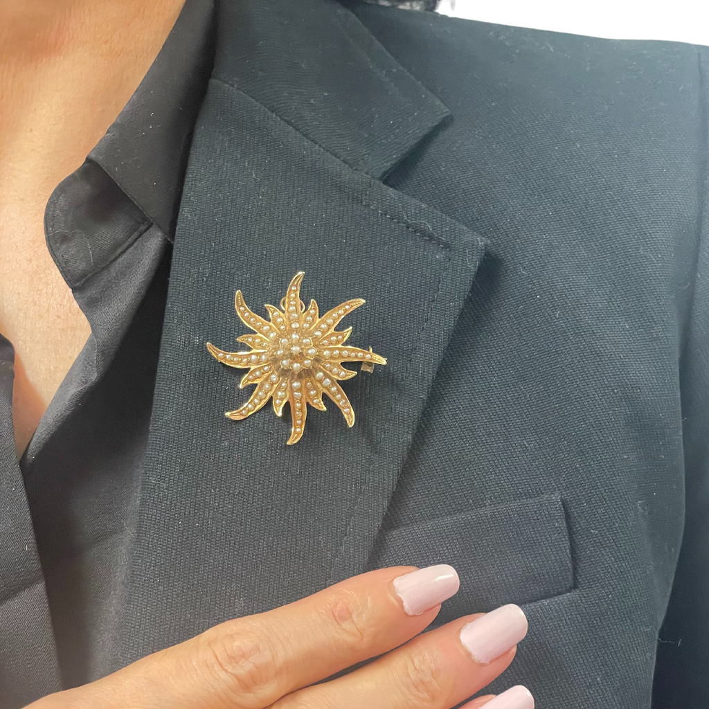 Charming 14k yellow gold brooch with seed pearls also convertible into a pendant. The sunburst was a popular motif in the late 1800s', it reveals a sense of optimism.