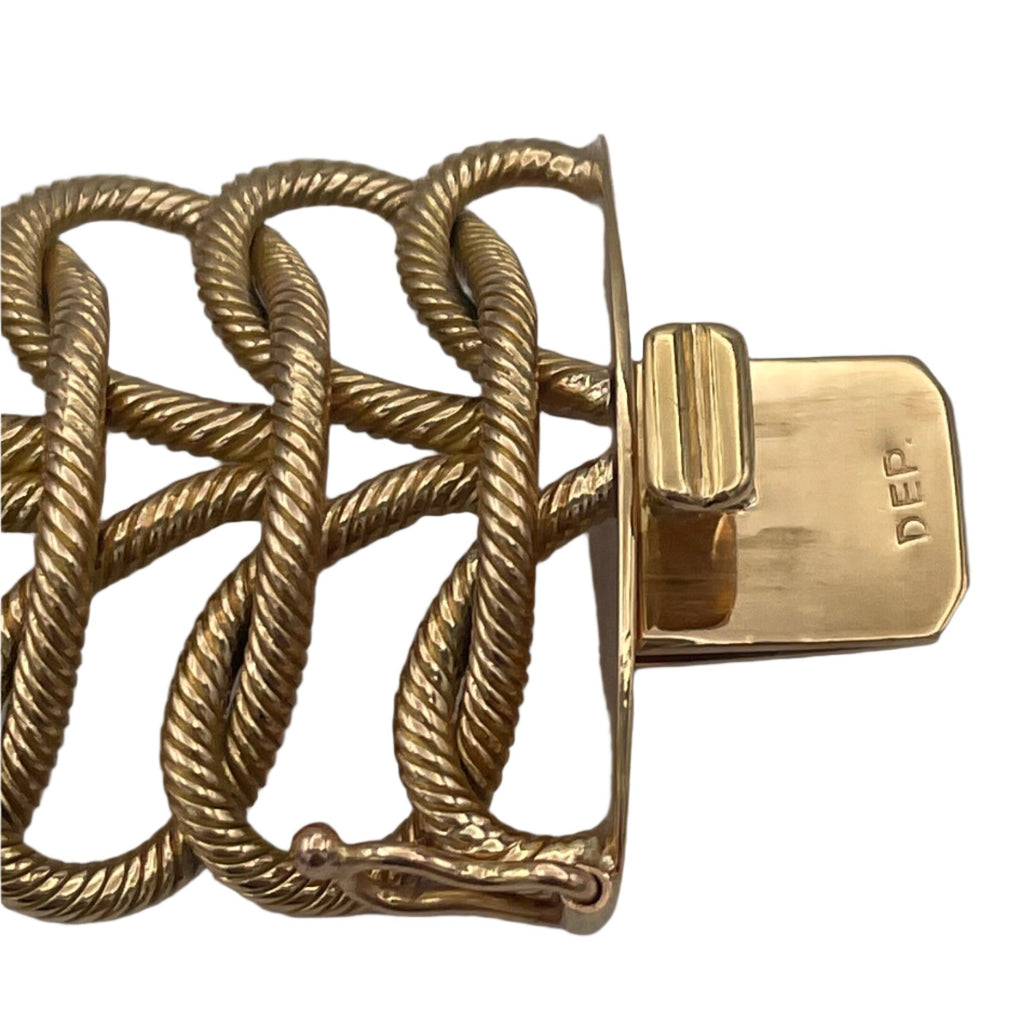 50-60's Italian 18k solid gold flexible woven link bracelet. Bracelet attaches with a push clasp.