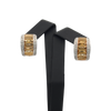 A pair of vintage 18k yellow gold earrings featuring rectangular yellow step cut citrines with pave set round brilliant cut diamonds on either side.