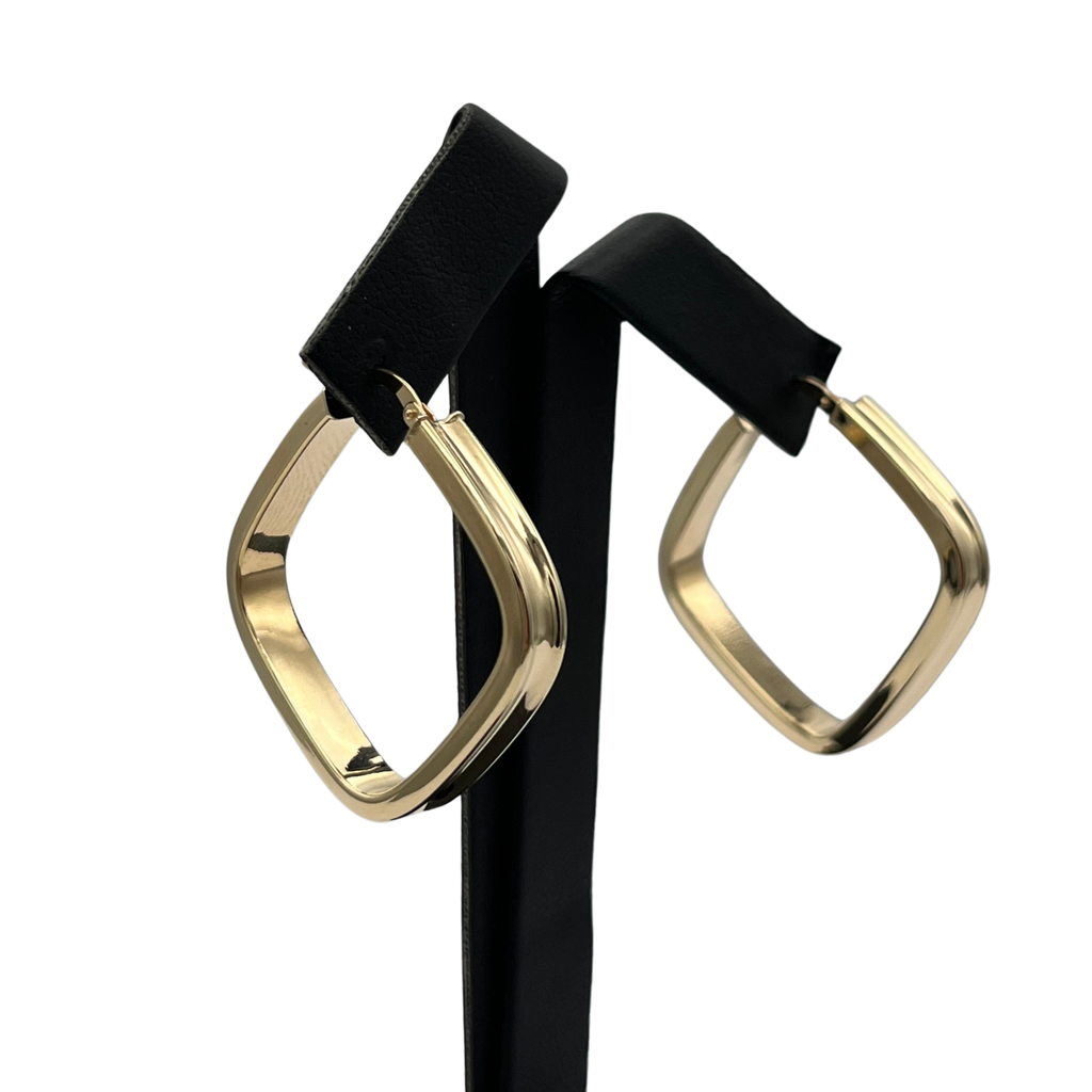 Gold hoop earrings on a white background