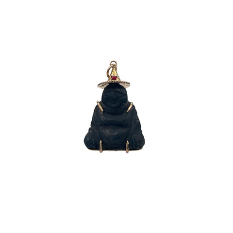 Very Rare Carved Black Sapphire (corundum) Buddha charm/pendant encased in 14k yellow/rose gold, with little decorative red glass stone on hat. Unique piece, chatoyance clearly visible on the face of the Buddha. Beyond the symbolism, this pendant is distinguished by its rarity.