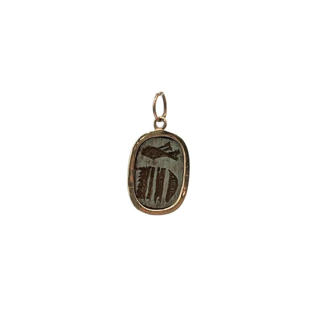 Vintage yellow gold Egyptian scarab charm. The Egyptian scarab (beetle) has been a popular motif in Ancient Egyptian as well as contemporary jewelry symbolizing renewal and rebirth. The reverse side has hieroglyph engraved.